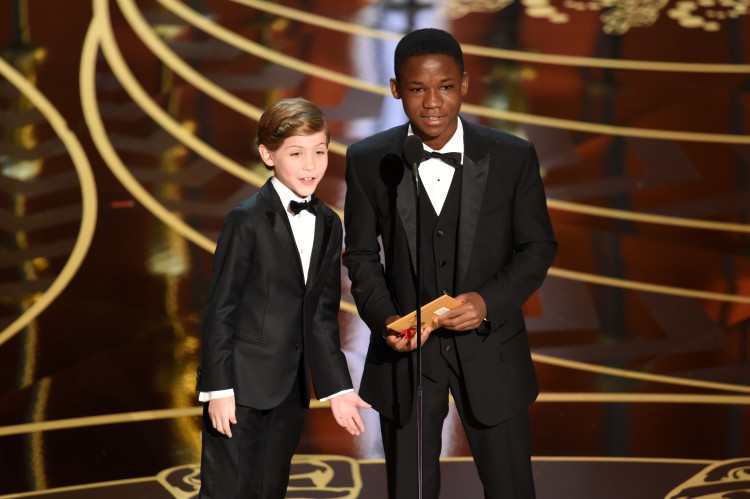 HOLLYWOOD, CA - FEBRUARY 28: Actors Jacob Tremblay (L) and Abraham Attah speak onstage during the 88th Annual Academy Awards at the Dolby Theatre on February 28, 2016 in Hollywood, California. (Photo by Kevin Winter/Getty Images)