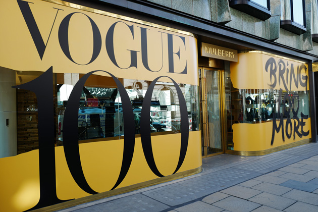 Major retail brands have created window displays across the UK to celebrate the centenary of British Vogue.